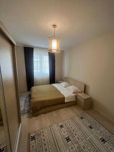 Postel nebo postele na pokoji v ubytování Grace Downtown Apartment