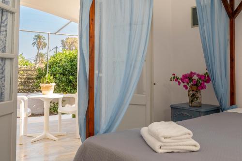 A bed or beds in a room at Irene Hotel Leros