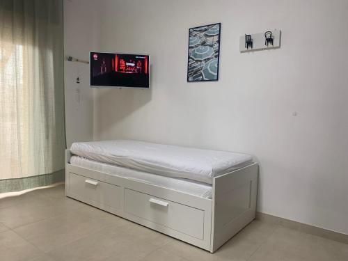 Una cama o camas en una habitación de Vitti Apartment