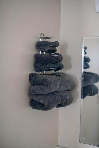 a bunch of towels hanging on a wall at Briarwood motor inn in Lincoln