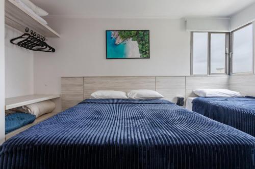 En eller flere senge i et værelse på Flat Magnifico c/ garagem! - 1308