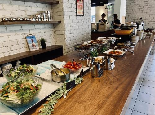 a buffet line with many different types of food at Court Hotel Shin-Yokohama in Yokohama