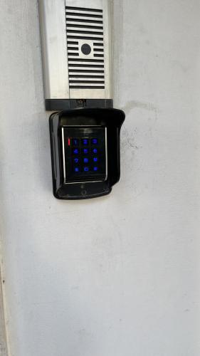 a cell phone sitting on the side of a wall at Villa Maria Palese in Bari