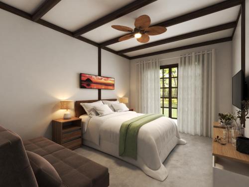 a bedroom with a bed and a ceiling fan at SUNSET PORTO BELO Locaçoes in Porto Belo