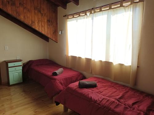 A bed or beds in a room at El sueño del flaco