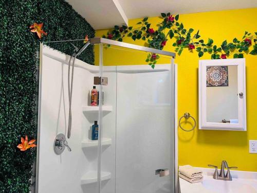 a bathroom with a shower and a sink at Two private apartments in Salem