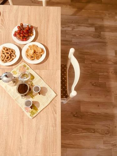 a table with plates of food on top of a wooden floor at Corte Perugia in Matino