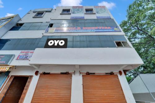 a building with the oo sign on it at Super OYO Flagship Glad Guest House in Patna