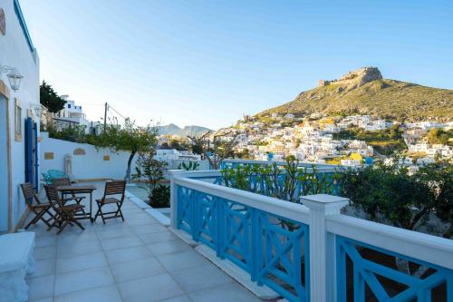 a balcony with a view of a city at HELIADES SUITES in Panteli