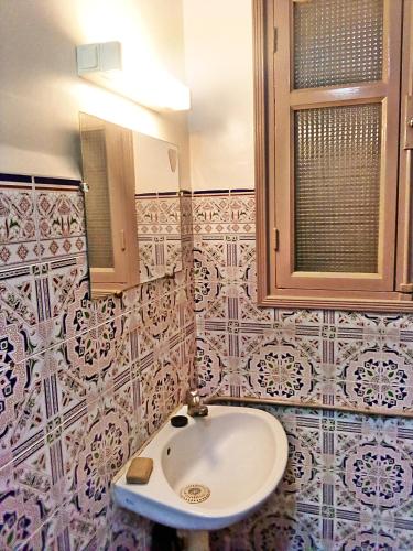 a bathroom with a sink and a mirror at hotel appart inezgane agadir in Inezgane