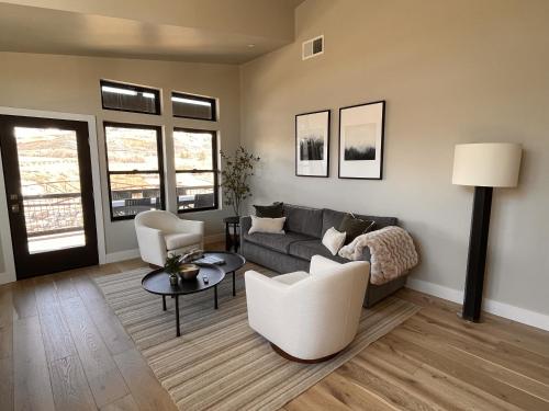 a living room with a couch and chairs and a table at Helling Circle Hideaway 303 condo in Heber City