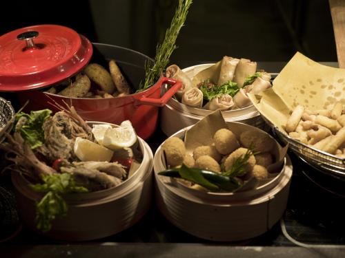 a group of five tin buckets filled with food at A.Roma Lifestyle Hotel in Rome