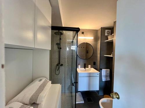 a bathroom with a shower and a sink at la vista in Colonia del Sacramento
