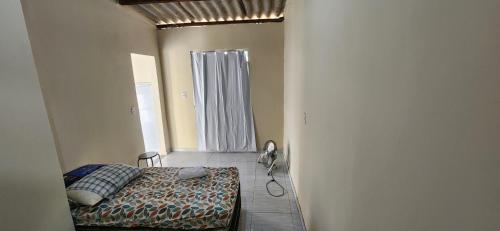 Säng eller sängar i ett rum på Suíte aconchegante e completa! Entrada independente em nova Iguaçu