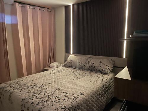 a bedroom with a bed with a white comforter and pillows at Antiquilla in Arequipa