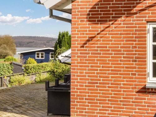 a brick wall with a window on a house at 6 person holiday home in B rkop in Børkop