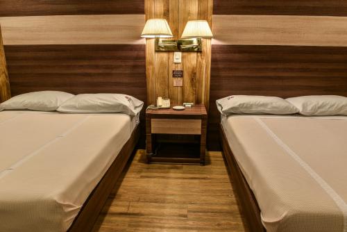 เตียงในห้องที่ Oliver Inn Tlalnepantla