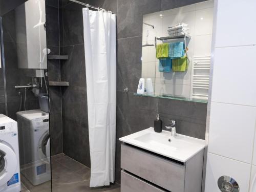 a bathroom with a sink and a shower at Schönauer Top 1 in Mariastein