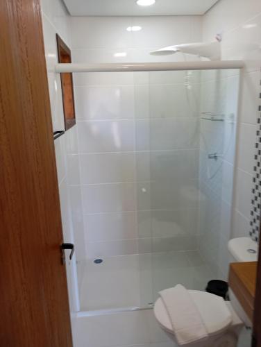 a bathroom with a shower with a toilet at Recanto do Sossego in São Sebastião