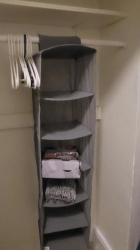 a walk in closet with shelves in a room at Large, Central, Lovely & Cozy 4bed/2bath - House by Everbank Stadium JACKSONVILLE in Jacksonville