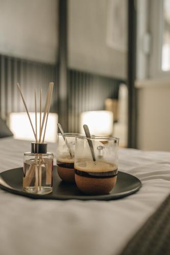 a plate with two bowls of food on a table at Apartman Premijer 1 in Čukarica