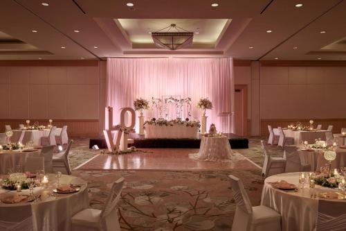 a banquet hall with white tables and chairs at The Westin Bayshore, Vancouver in Vancouver