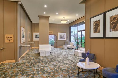 a lobby with chairs and tables in a building at The Westin Bayshore, Vancouver in Vancouver
