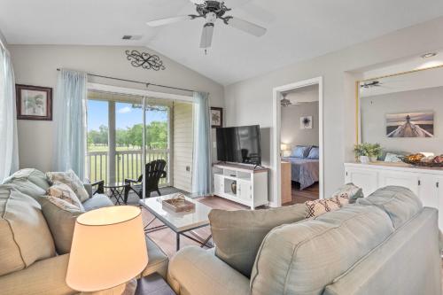 a living room with a couch and a tv at Close to Beach, Ripken, Golf 2B-2B Condo in Myrtle Beach