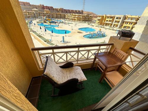a balcony with a view of a swimming pool at Porto El Sokhna Aqua park in Ain Sokhna
