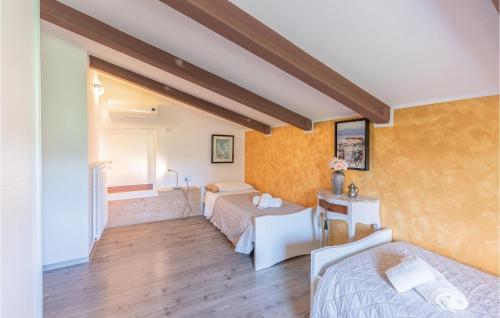 a bedroom with two beds in a room at Beautiful Home In Lazise Vr With 3 Bedrooms And Outdoor Swimming Pool in Lazise