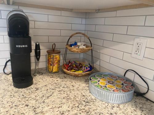 a kitchen counter with two trays of food and a heater at Catchy Relax Bradenton Beauty mins to Beaches in Bradenton