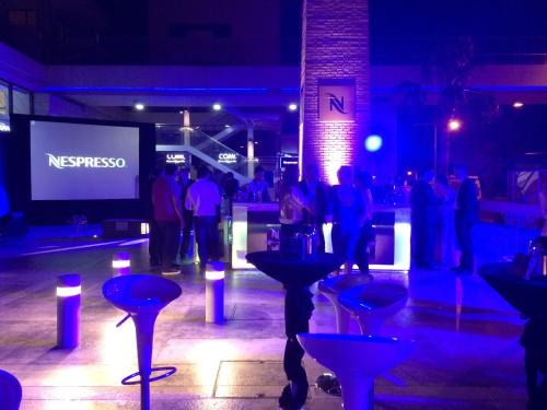 a group of people standing in a room at night at Olympic Residence Deluxe Apartments in Limassol