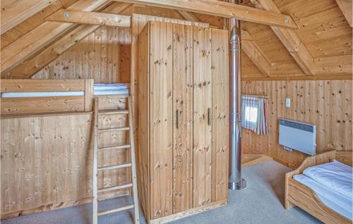 a room with a bunk bed and a ladder in a cabin at Beautiful Home In St,georgen Am Kreischb, With 2 Bedrooms, Wifi And Indoor Swimming Pool in Sankt Lorenzen ob Murau