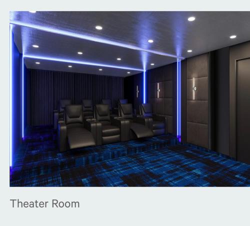 a theater room with chairs and blue lights at LITTLE HAVEN in Newark