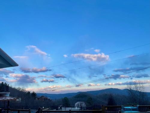 a view of a blue sky with mountains in the background at Skyline Village Inn in Spruce Pine
