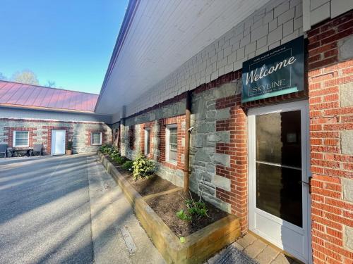 a brick building with a sign that reads milwaukee us mile at Skyline Village Inn in Spruce Pine