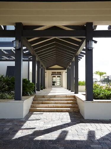 a building with a walkway leading to a building at The Island House in Nassau