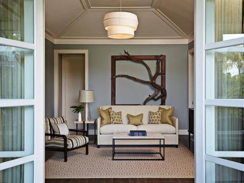 a living room with a couch and a table at The Island House in Nassau