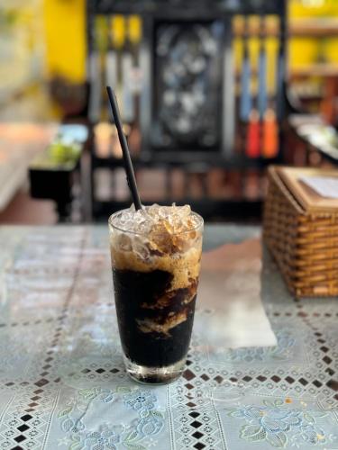 a drink sitting on top of a table at Kara Homestay & Cafe in Can Tho