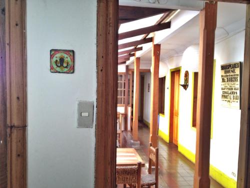 a hallway with tables and chairs in a building at Tralkan B&B in Santiago
