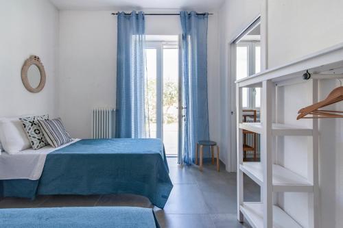 Ένα ή περισσότερα κρεβάτια σε δωμάτιο στο Agrihouse Fronte mare Torre dell'Orso