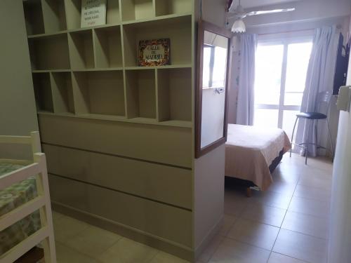 a room with a bedroom with a bed and a window at Alquiler Temporario Tucumán Con Cochera Y Pileta in San Miguel de Tucumán