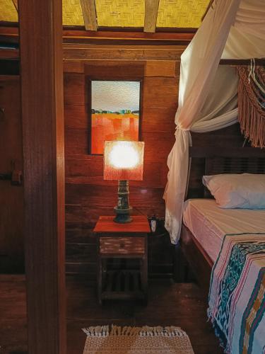 Voodi või voodid majutusasutuse Alaya Ecolodge toas