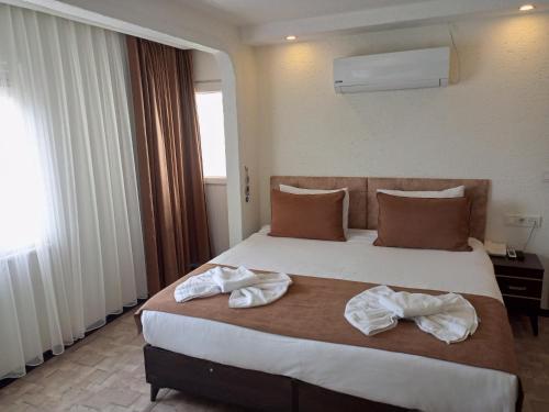 Cama o camas de una habitación en HOTEL GLOBAL 2022