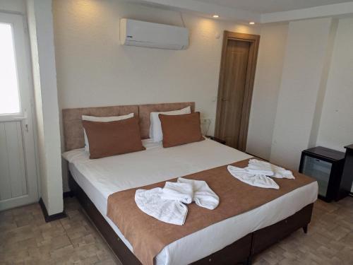Cama o camas de una habitación en HOTEL GLOBAL 2022
