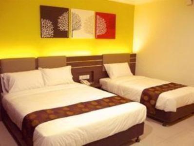 Postel nebo postele na pokoji v ubytování GM Holiday Hotel