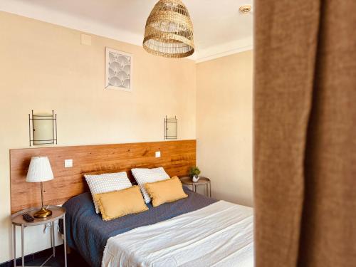 Ένα ή περισσότερα κρεβάτια σε δωμάτιο στο Hôtel le Nid