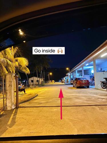 a red arrow pointing into a parking lot at Nature Camp House 2km Jeti Mersing Centre in Mersing