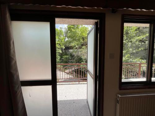 an open door with a view of a bridge at Galata's Bridge Hotel in Galata