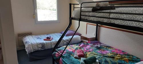 Uma ou mais camas em beliche num quarto em Cap'tain Cook